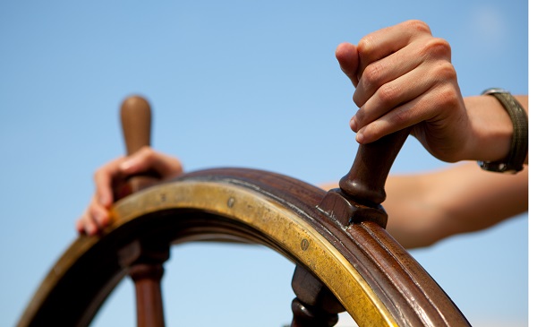 Hands on ship's rudder