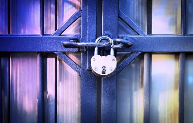 Padlock on a door to represent gating in eLearning